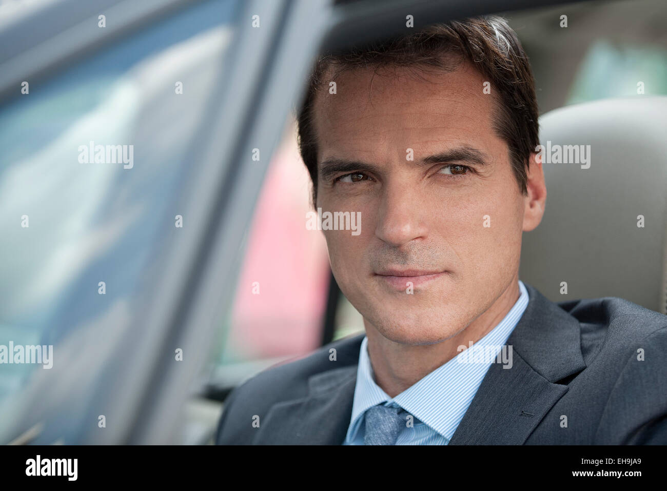 Businessman driving car Stock Photo