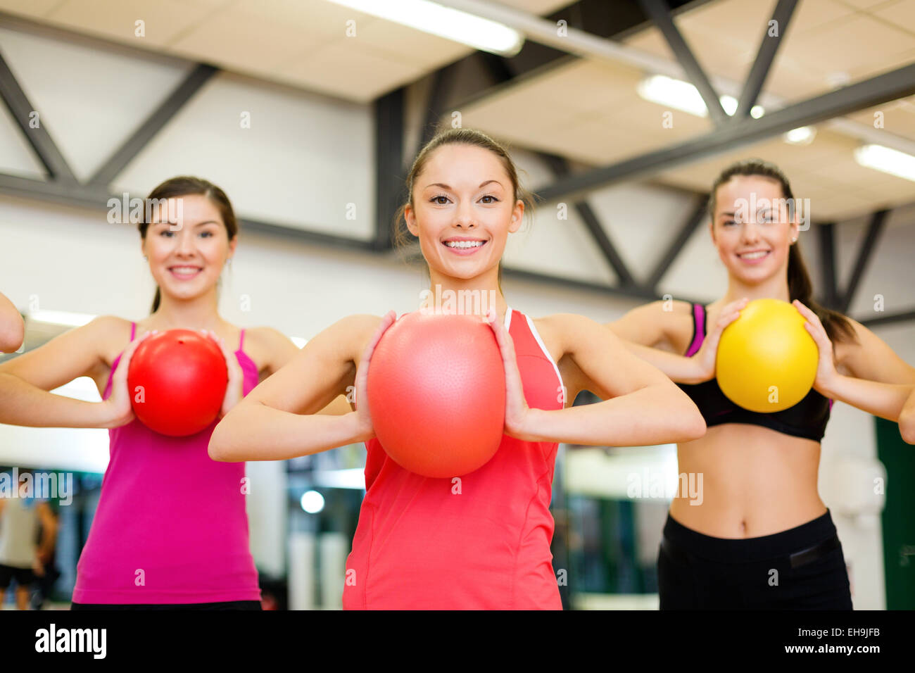 group of people working out with stability balls Stock Photo