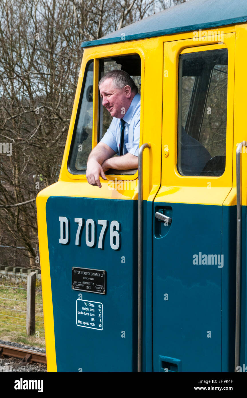 Train driver leaning out the drivers window of a Class 35 Hymek diesel
