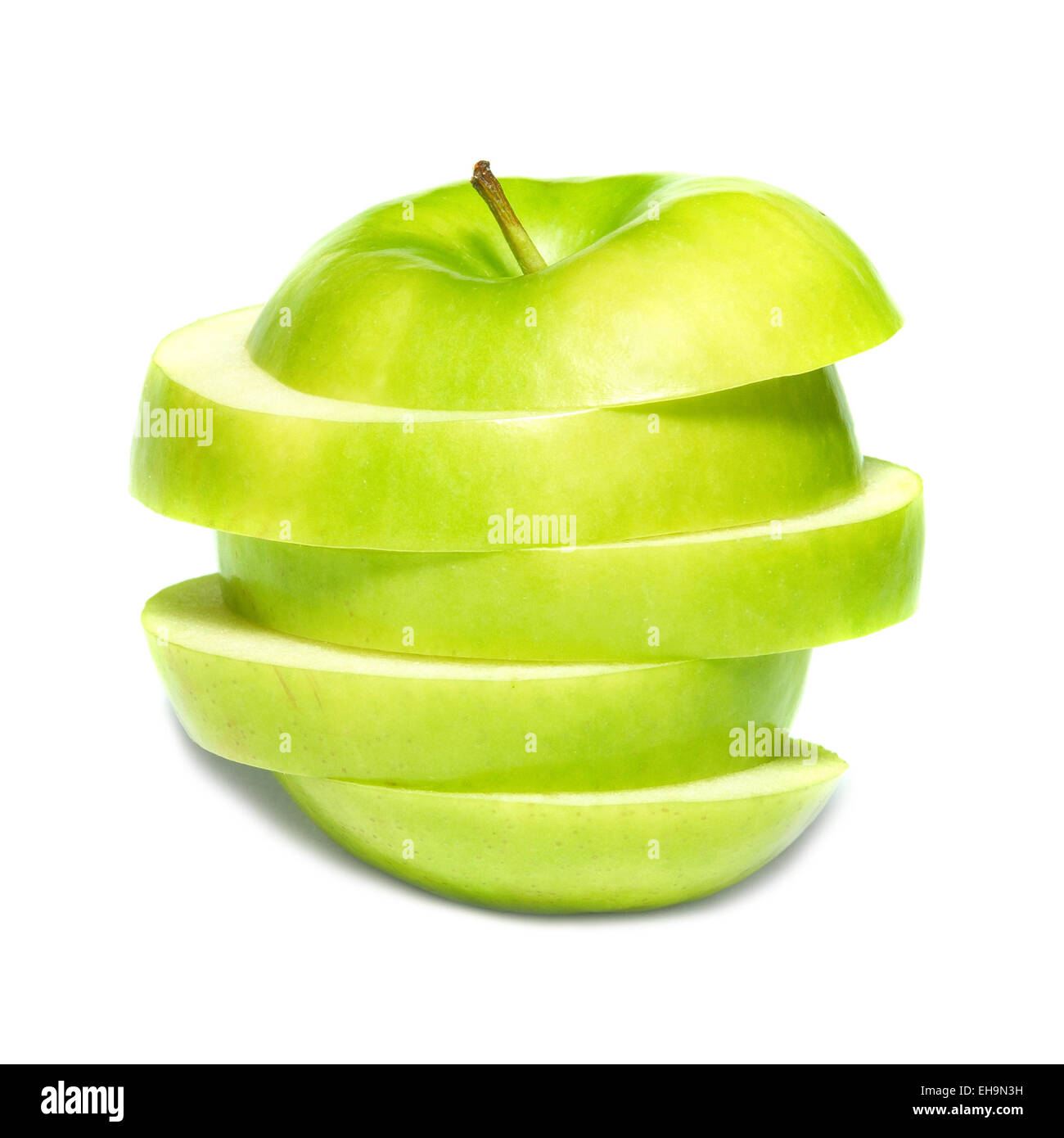 Sliced green apple isolated on white background Stock Photo - Alamy