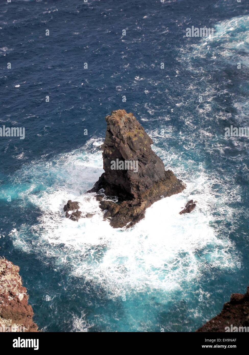 Waves crushing into the rocks at sea Stock Photo