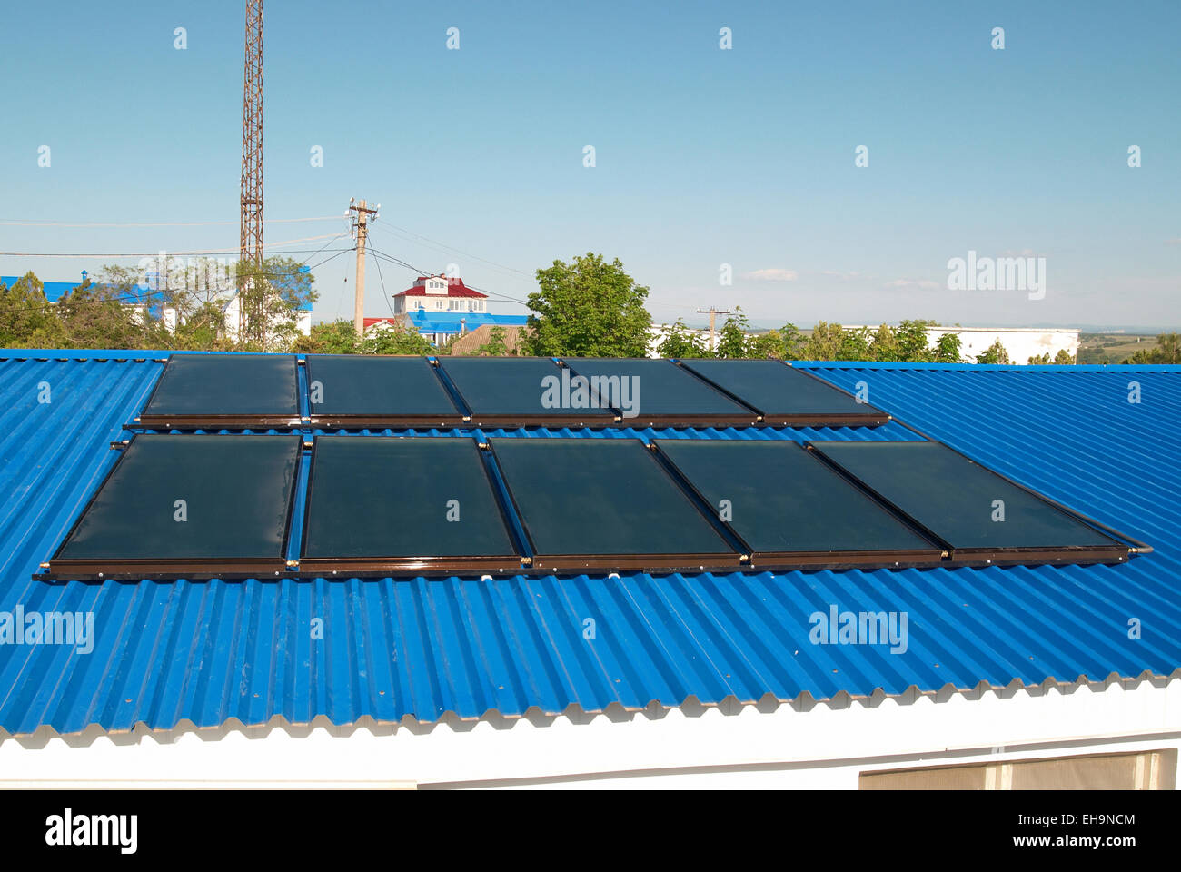 Solar water heating system on the house roof Stock Photo - Alamy