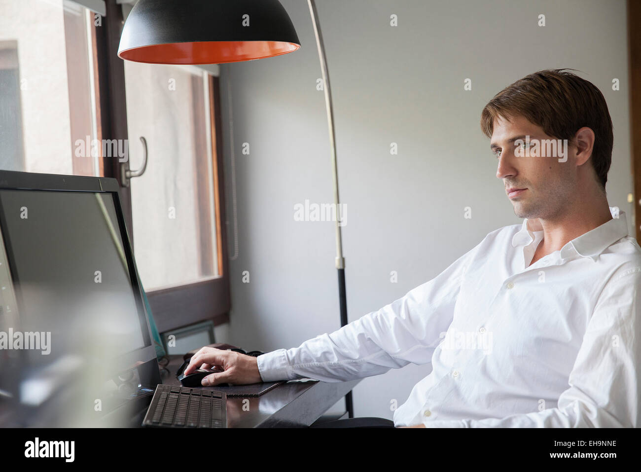 Man using desktop computer Stock Photo