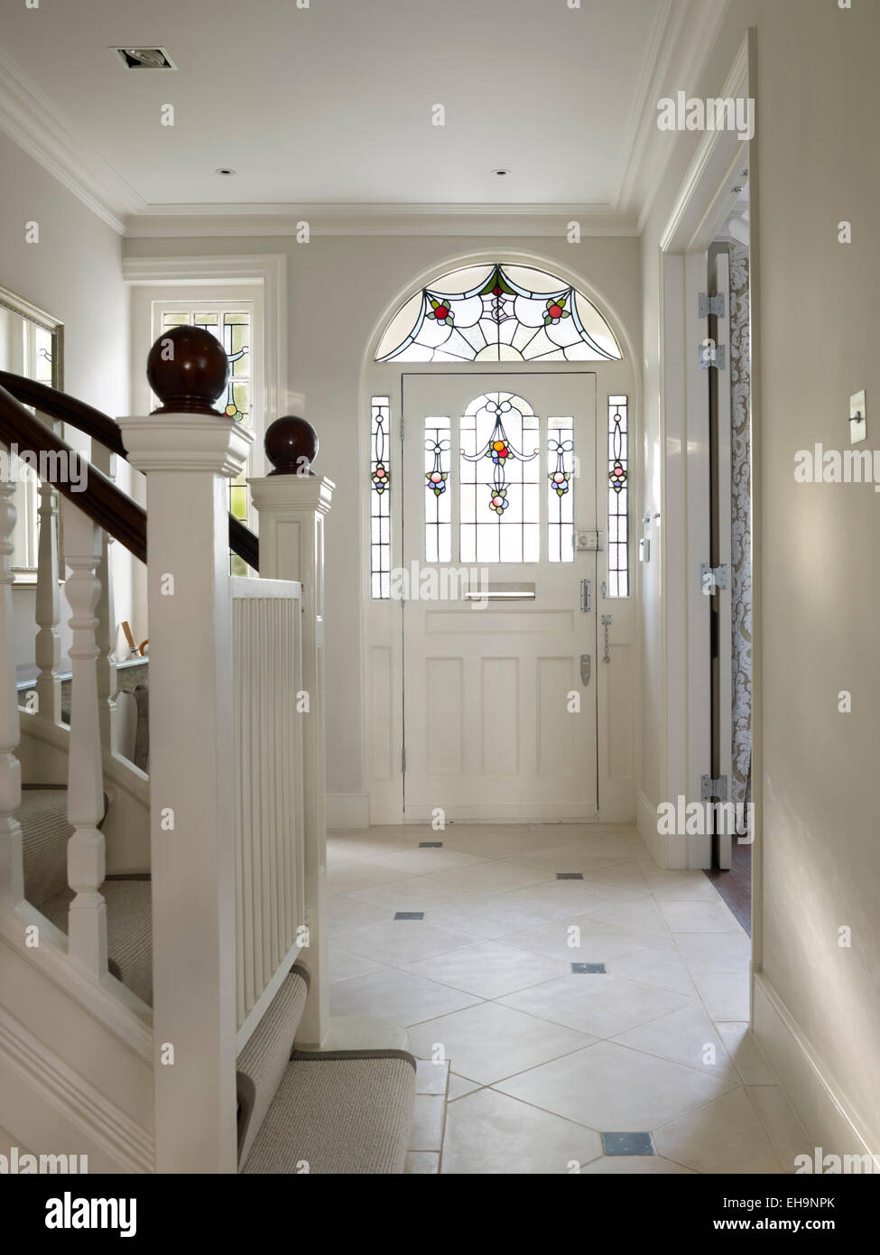 Front hallway with stained glass frontage in Edenhurst Road home, UK Stock Photo
