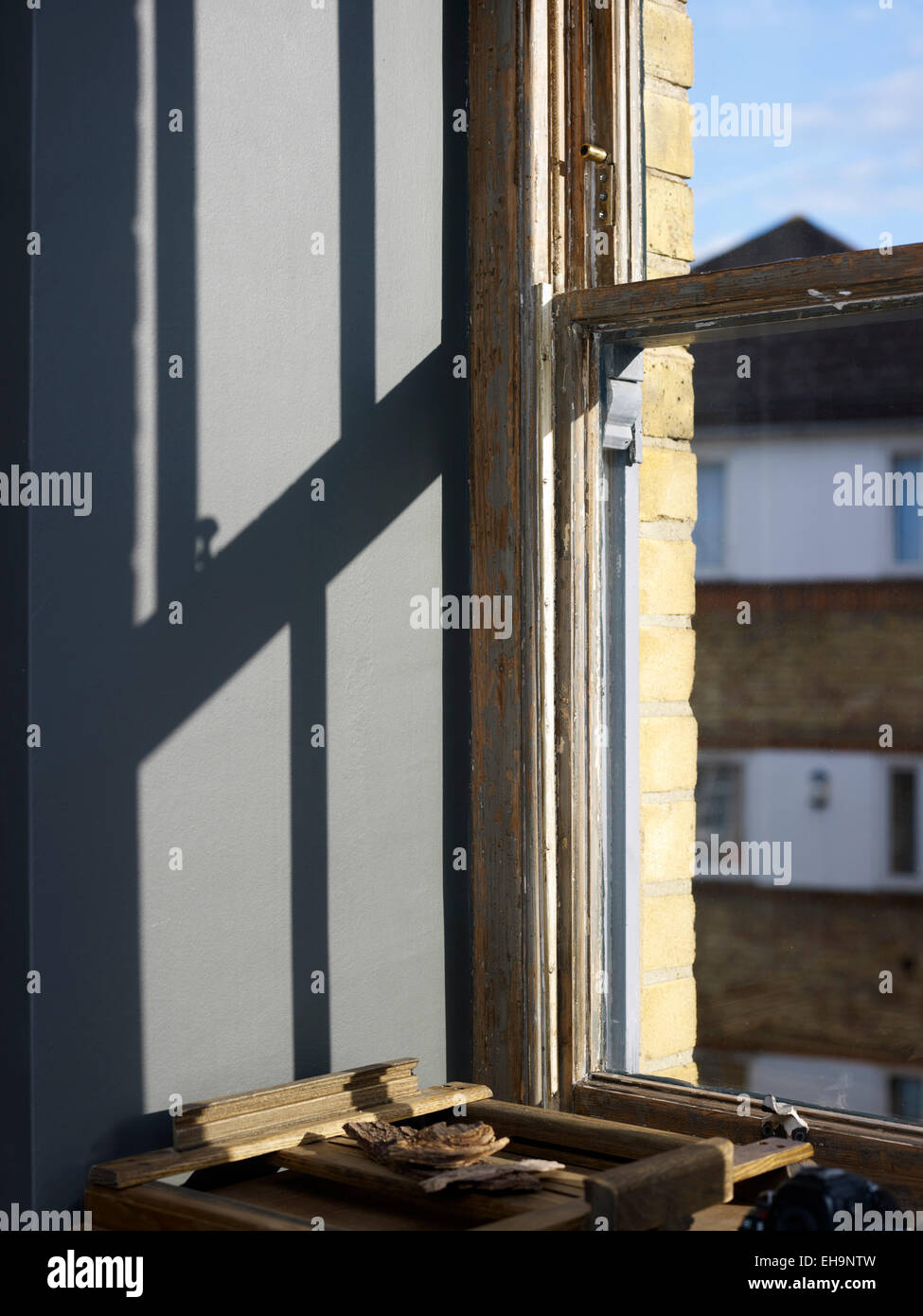 Sliding window mechanism detail sun reflections in Corbetts Wharf