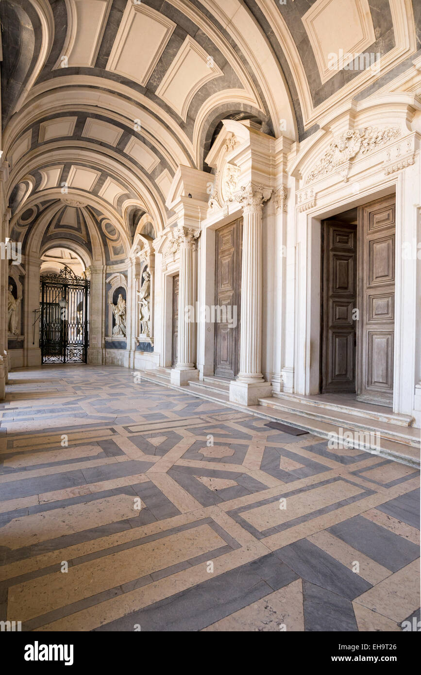 Entrance to Italian Baroque sculptures in Mafra National Palace and Convent in Portugal. Baroque architecture. Stock Photo