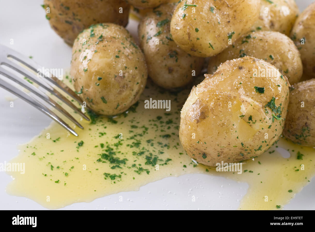 Buttered new potato with parsley, butter and salt Stock Photo Alamy