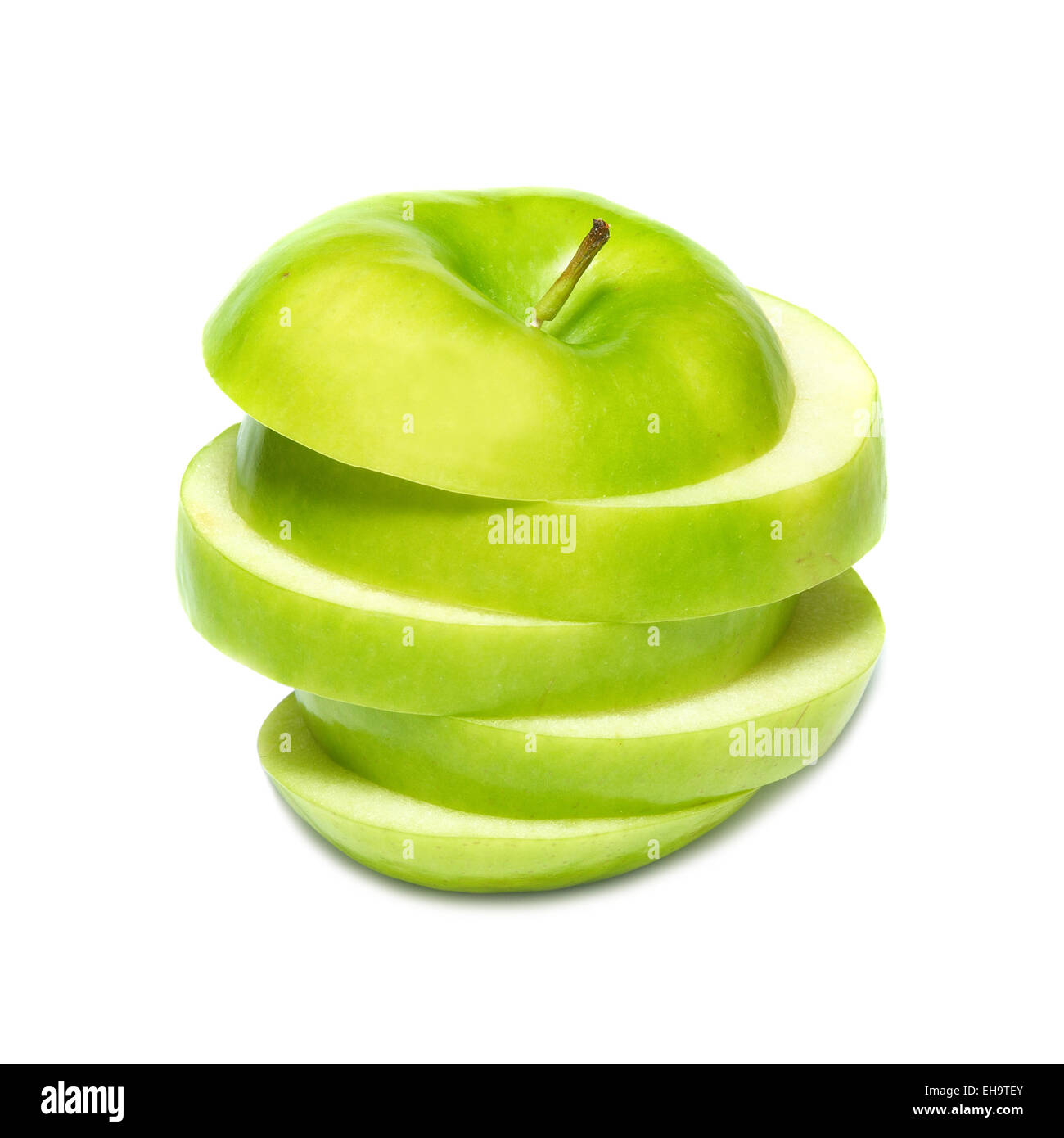 Sliced green apple isolated on white background Stock Photo - Alamy