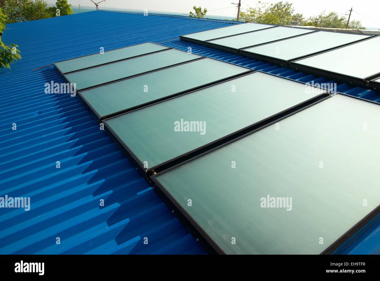 Solar water heating system on the house roof Stock Photo - Alamy