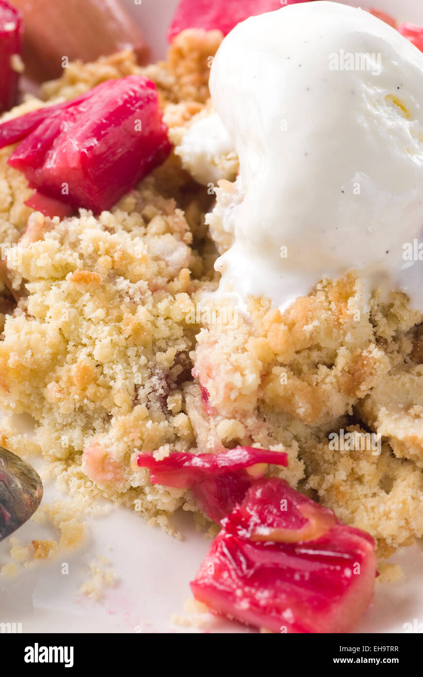 Rhubarb crumble with vanilla ice cream. Stock Photo