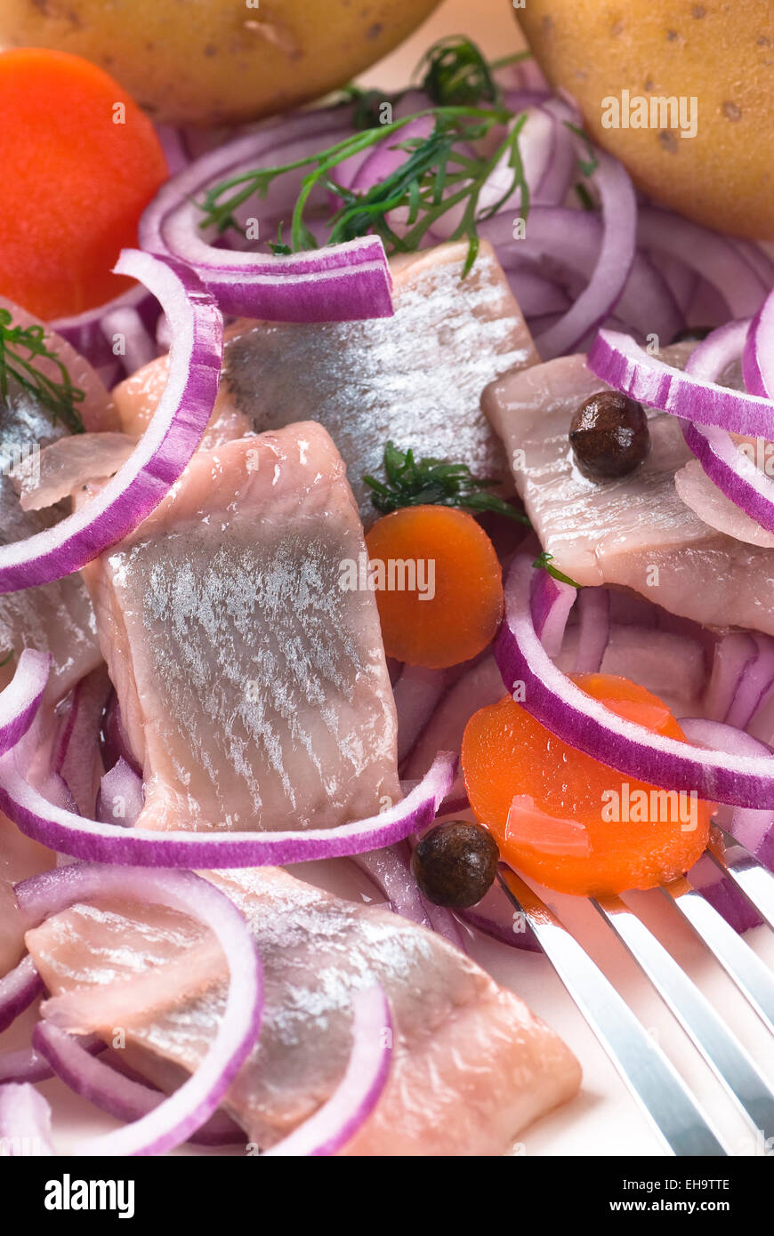 Pickled herring with onion and potato Stock Photo Alamy