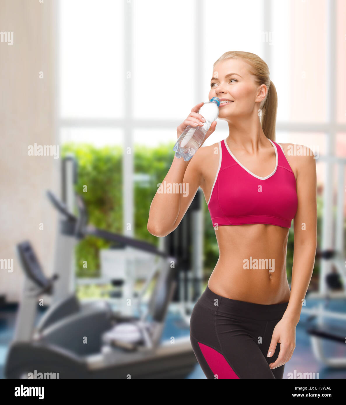 smiling woman with bottle of water Stock Photo - Alamy