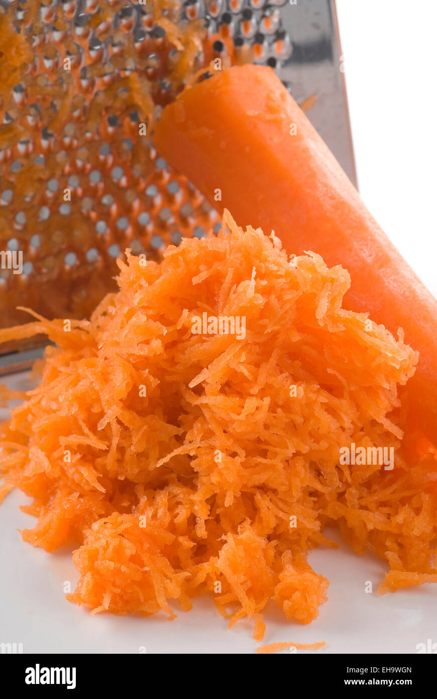 Grated carrot on a plate. Stock Photo