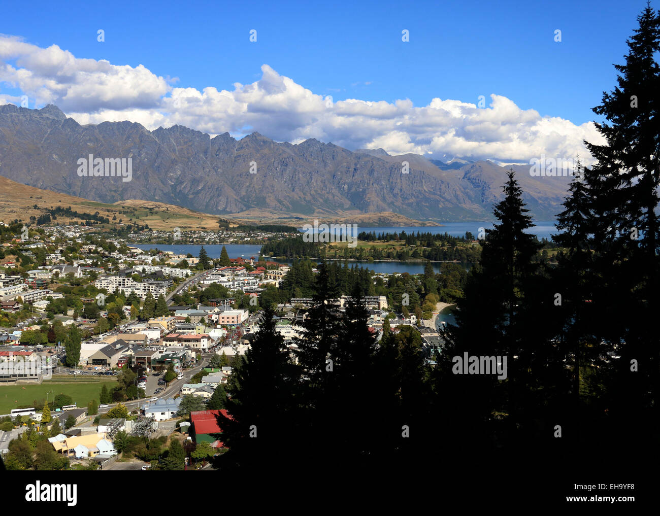 The Remarkables mountain chain over Queenstown New Zealand peak mountain side rock tramp trail Stock Photo