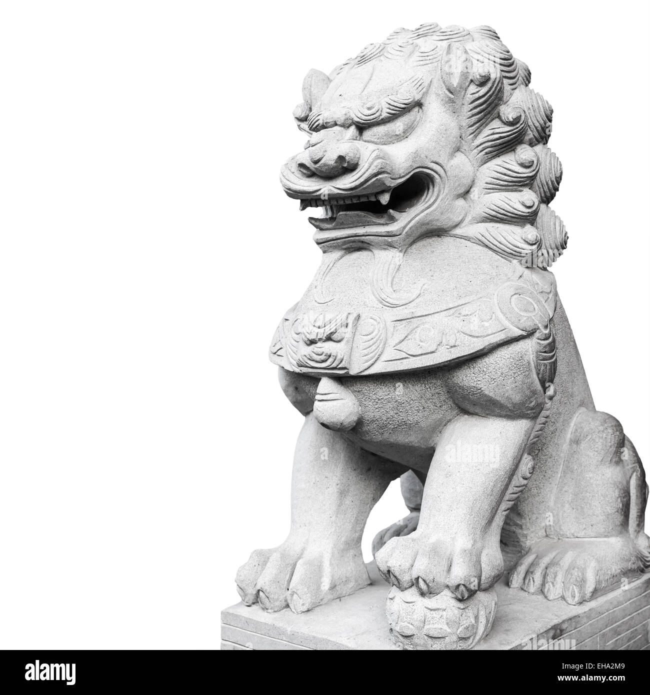 Ancient Chinese lion statue made of gray stone isolated on white background Stock Photo