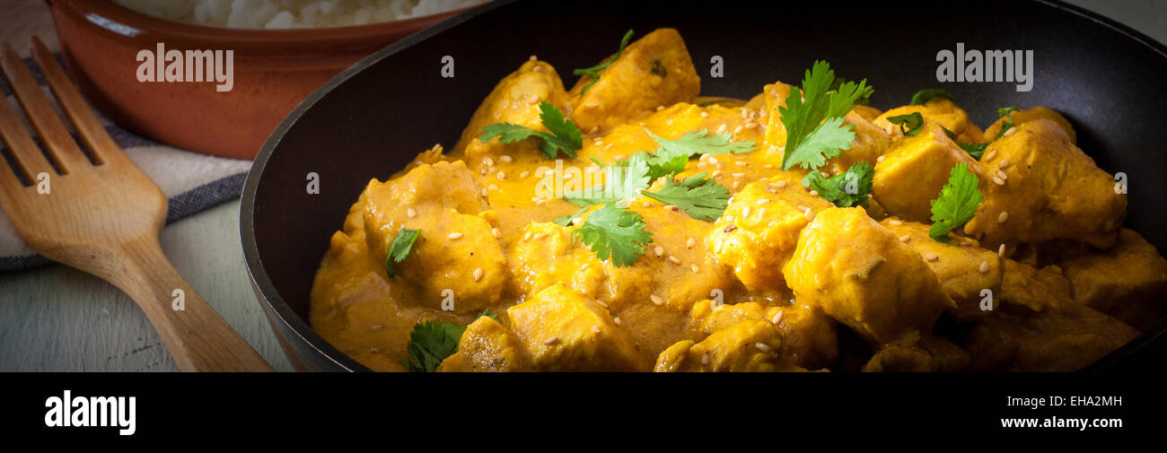 Butter chicken curry with basmati rice and cilantro. Stock Photo