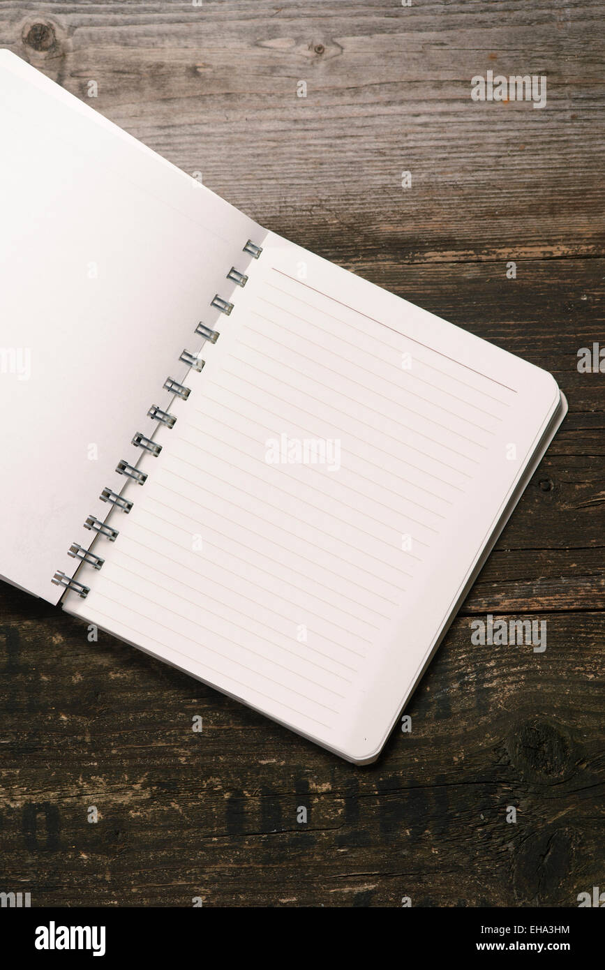 white Notepad on a dark wooden background Stock Photo