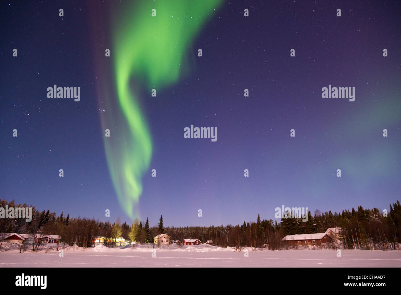 The aurora borealis or Northern Lights in the night sky over a frozen ...