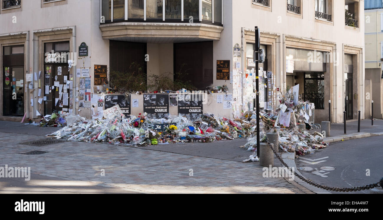 Flowers and tributes near to the Paris office of Charlie Hebdo, March 2015. Months after the tragedy the tributes grow. Stock Photo