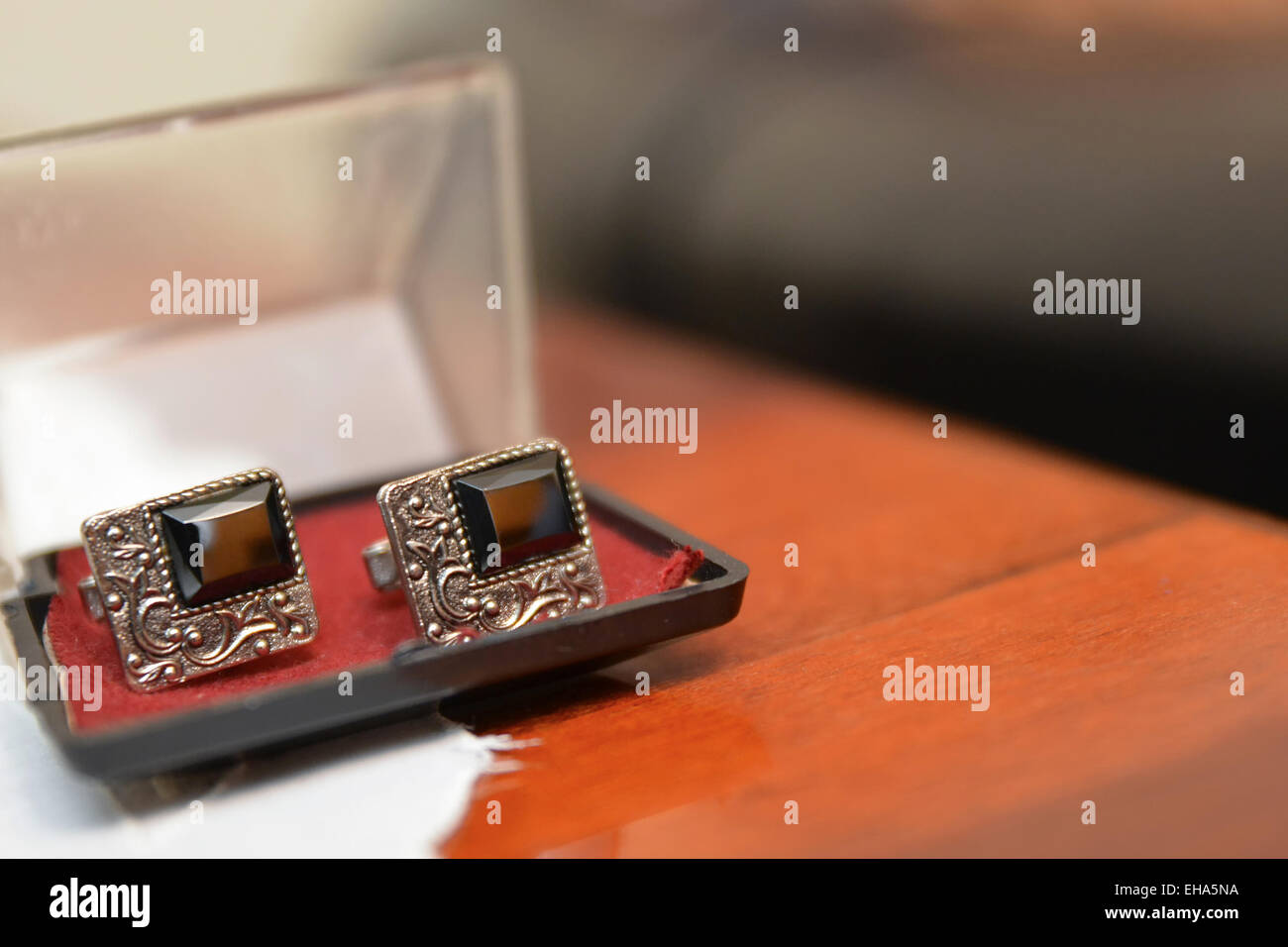 Silver Cufflinks placed in a plastic black box Stock Photo