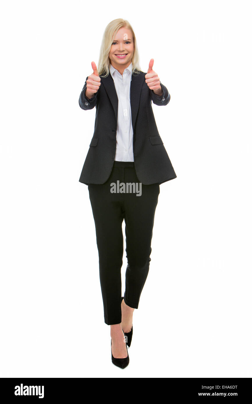 smiling blonde businesswoman thumbs up with both hands Stock Photo