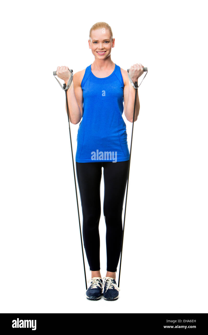 woman wearing fitness clothing exercising with rubber band Stock Photo
