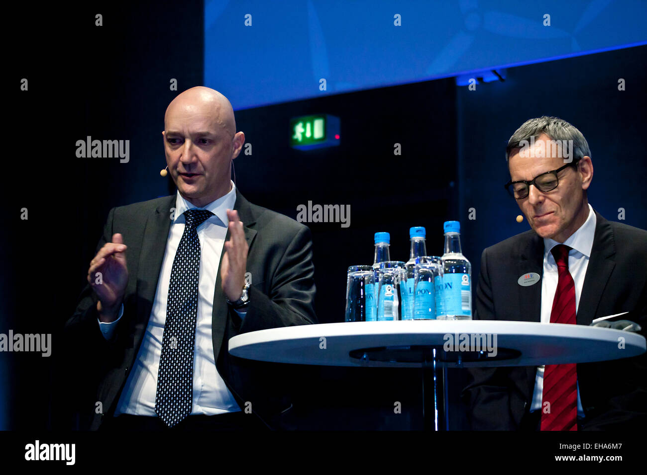 CEO in MHI Vestas Offshore Wind, Mr Claus Hviid Christensen (photo, left) , and Mr. Jens Tommerup (photo, right), discuss at the podium at EWEA 2015 conference and exhibition opening ceremony in Copenhagen. The big issue is to achieve cost reduction so wind energy can compete with fossil energy Credit:  OJPHOTOS/Alamy Live News Stock Photo
