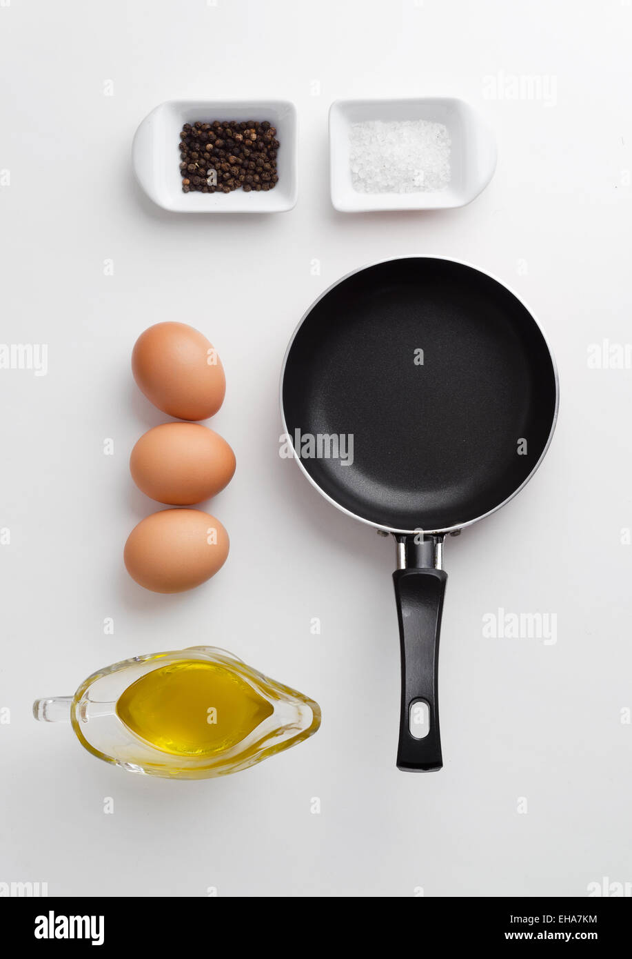 Scrambled eggs ingredients over white table, above view Stock Photo - Alamy