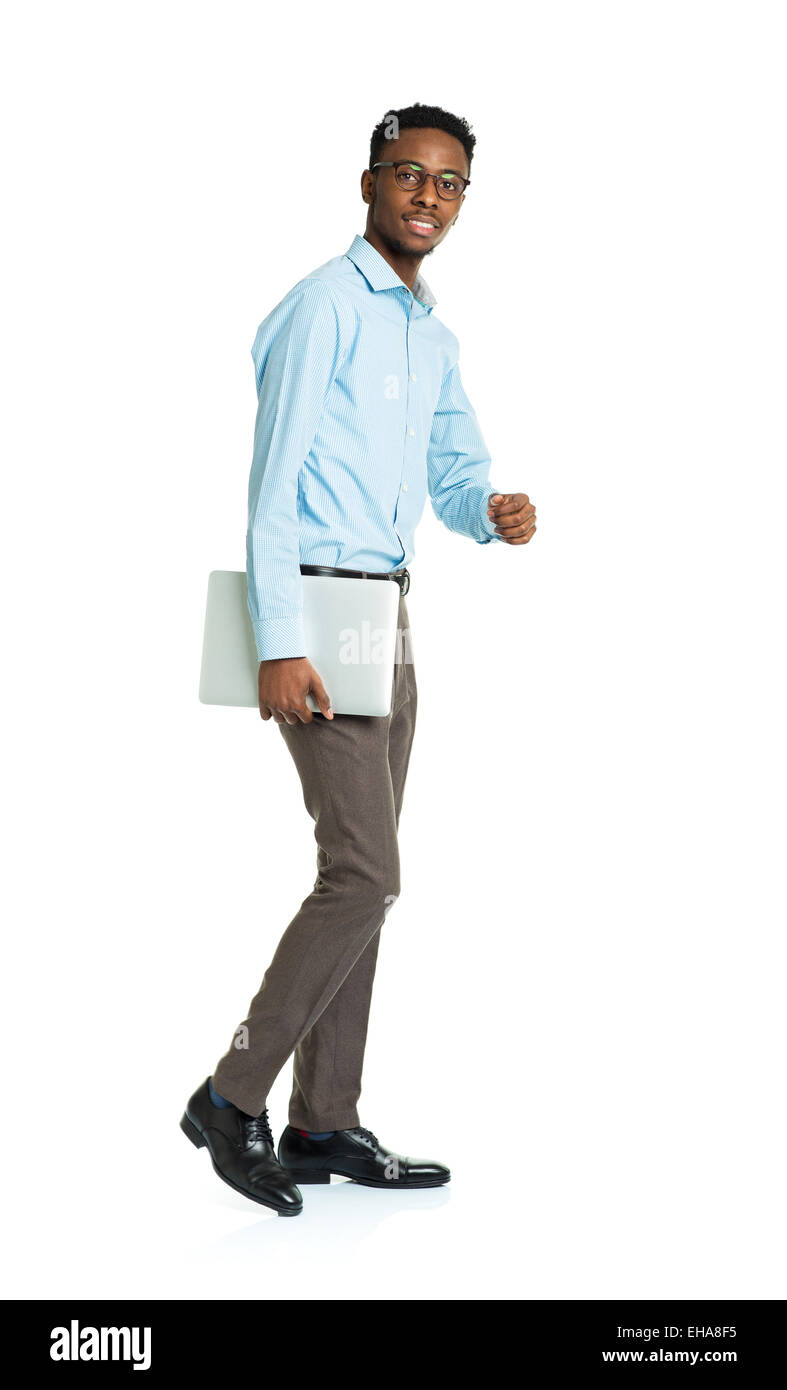 Happy african american college student with laptop standing on white background Stock Photo