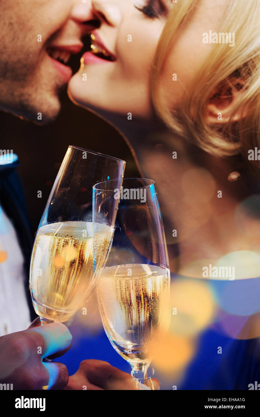 Cheerful couple kissing and drinking a champagne Stock Photo Alamy