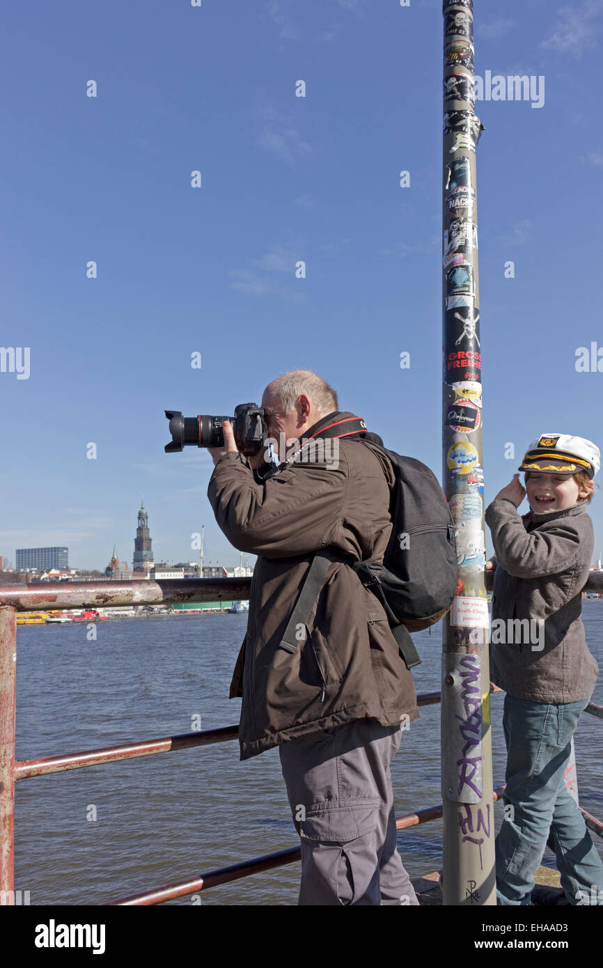 man taking photographs at the harbour of Hamburg, Germany Stock Photo