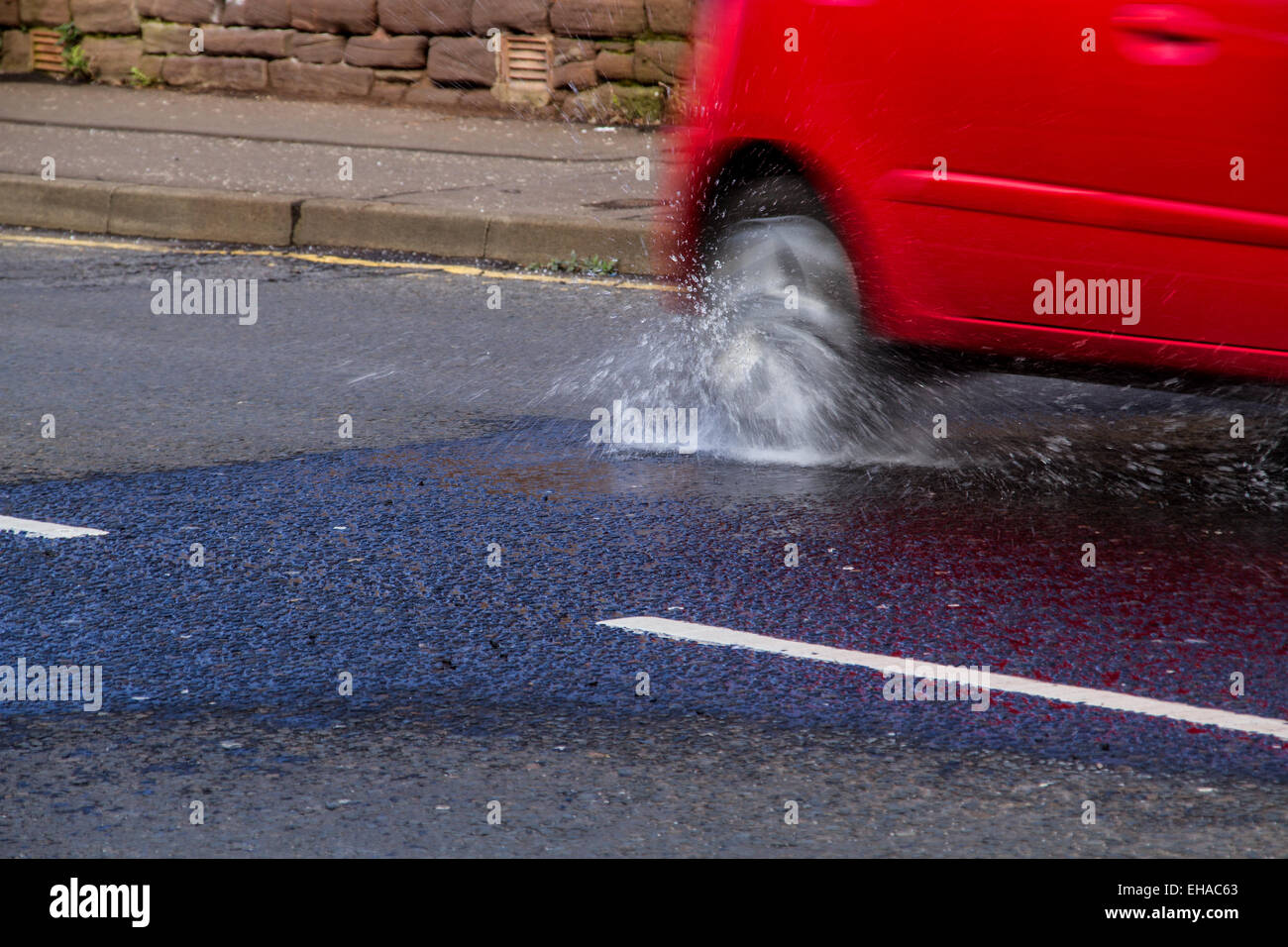 Scottish Drivers struggling to cope with pothole problems along Dens Road in Dundee, UK Stock Photo