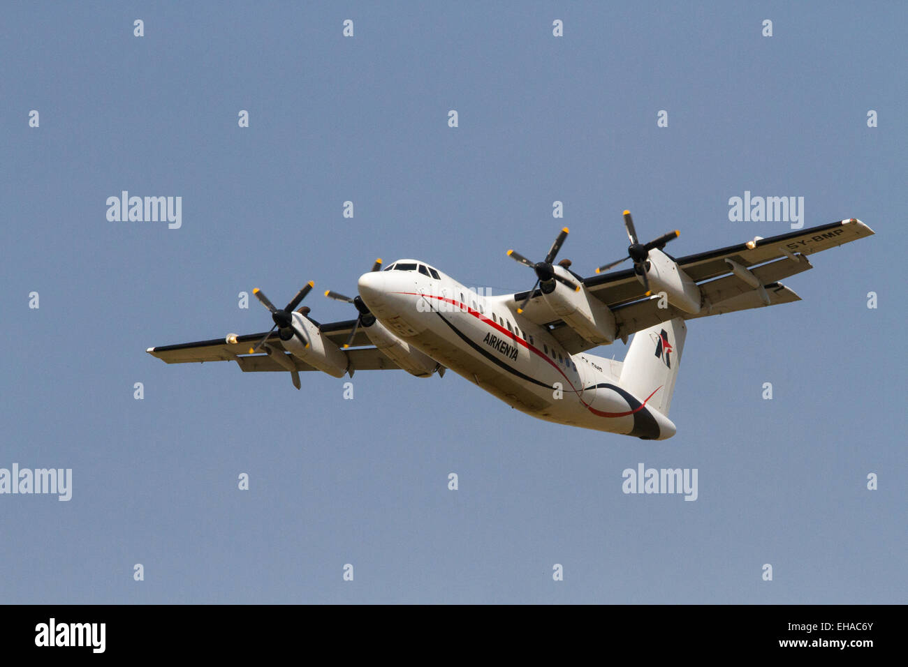 Air Kenya plane DHC7102 5YBMP taking off from the Masai Mara, Kenya