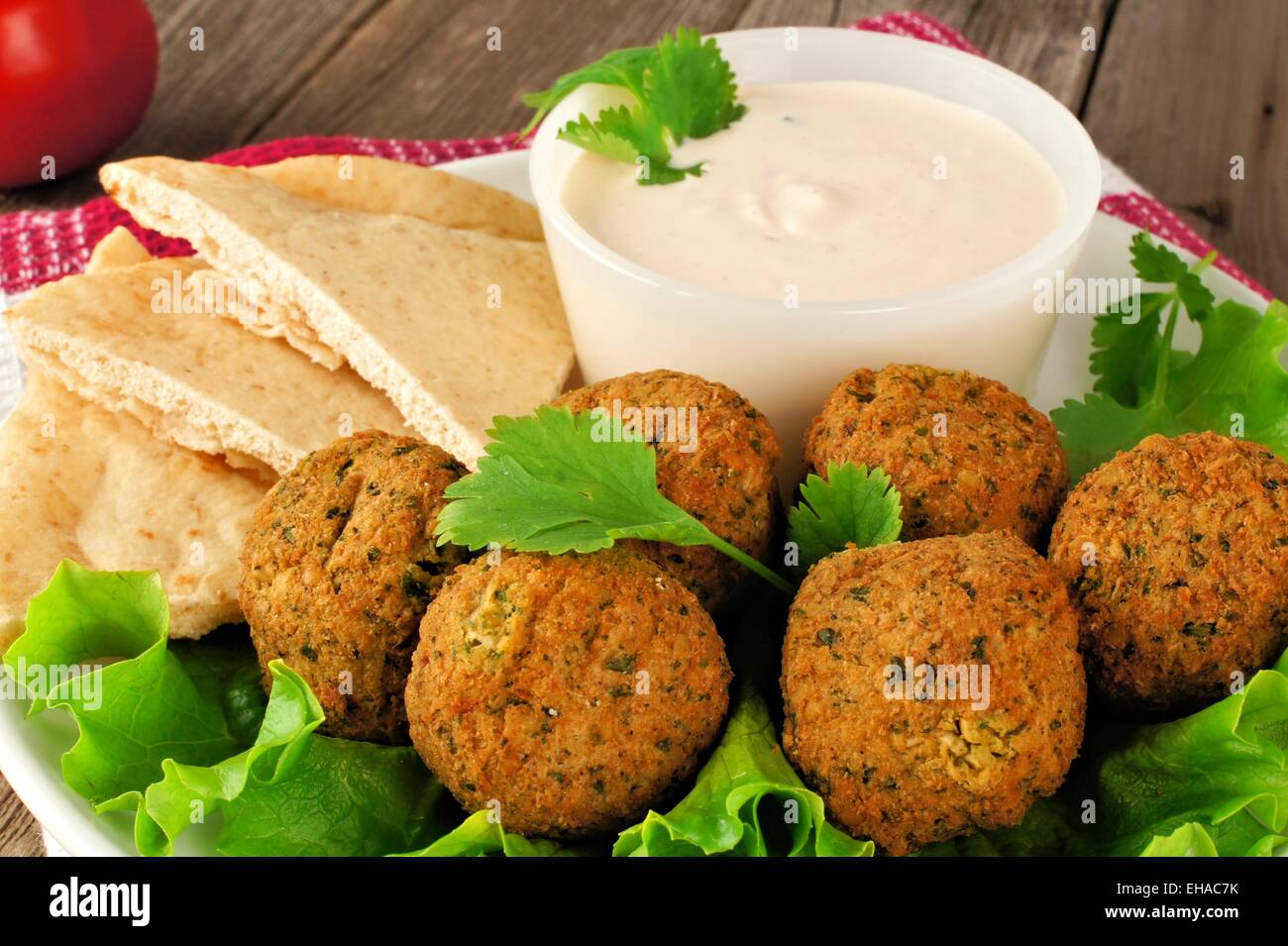 Falafel on lettuce with pita bread and tzatziki sauce close-up Stock Photo