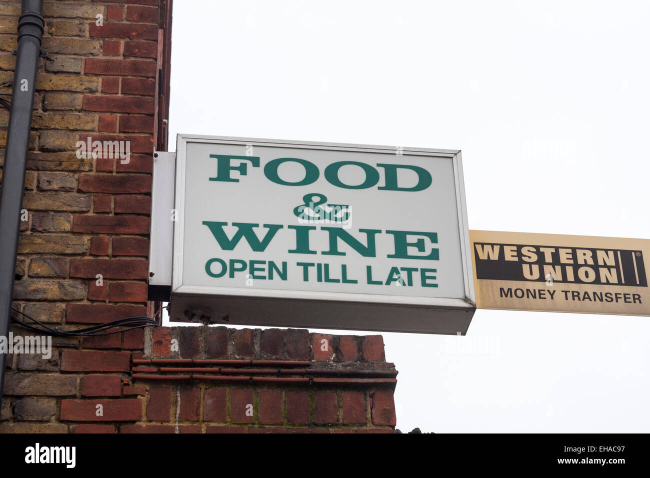 'Food and Wine' and Western Union outside signs Stock Photo