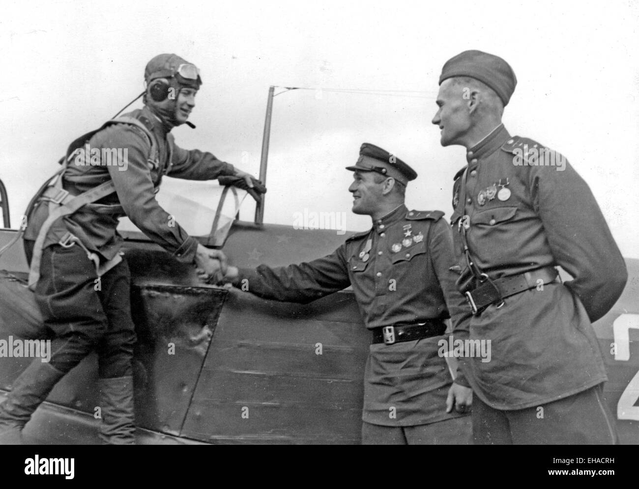 SIEGE OF LENINGRAD 1941 Original caption: 'Fighter pilot Captain Mochalov being greeted by his friends on returning from a successful sorties in which he shot down his thirteenth enemy plane' Stock Photo