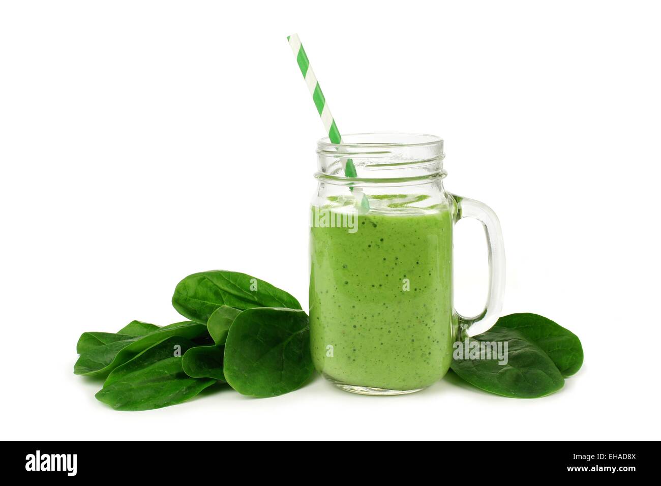 Healthy green smoothie with spinach in a jar mug isolated on white Stock Photo