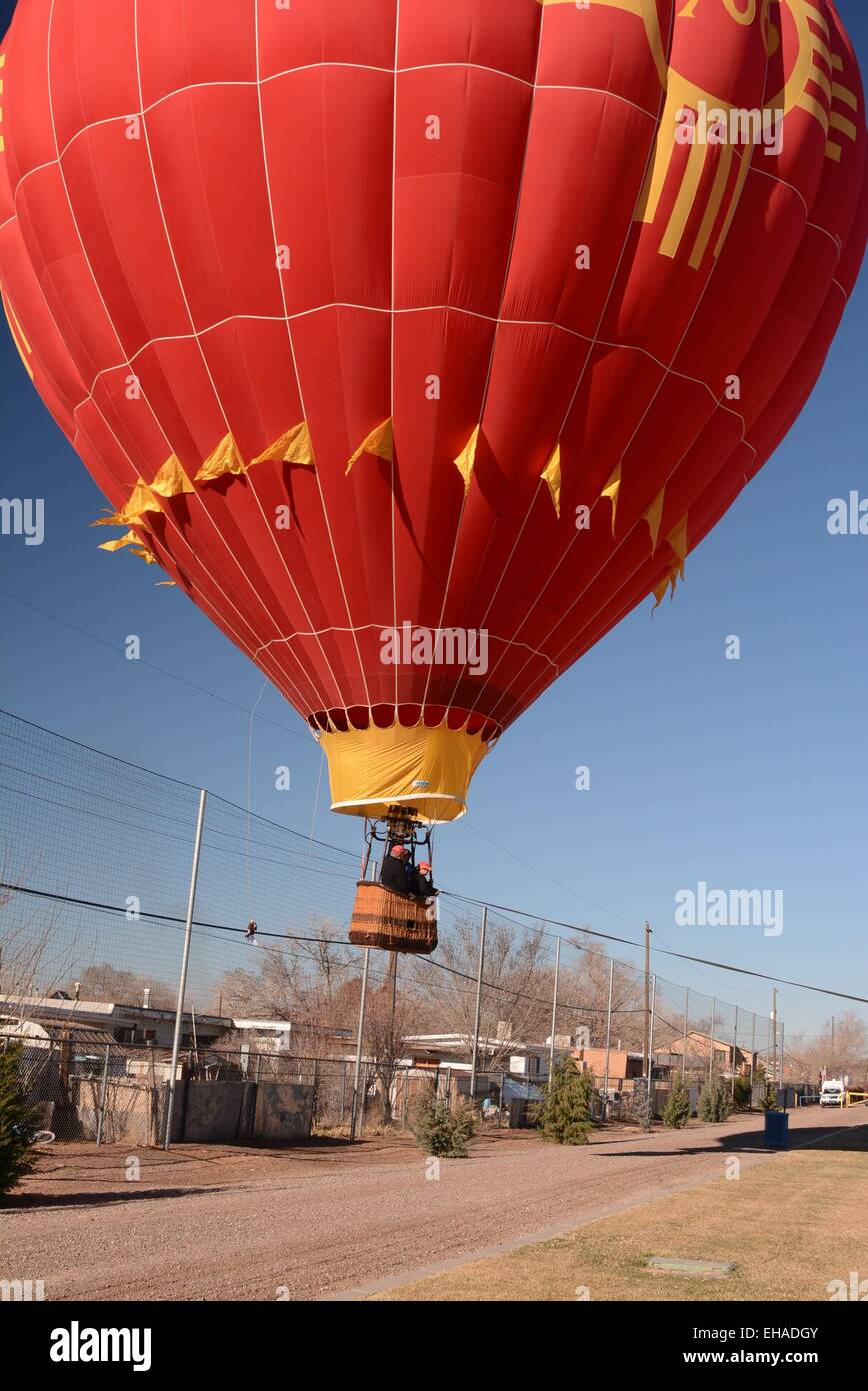 Balloonists  hauled to safety away from power lines Stock Photo