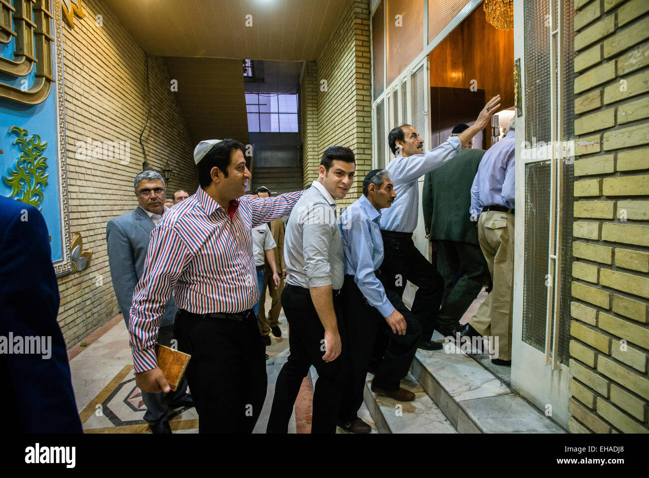 Jews come in praying hall of Yusef Abad Synagogue, one of the biggest