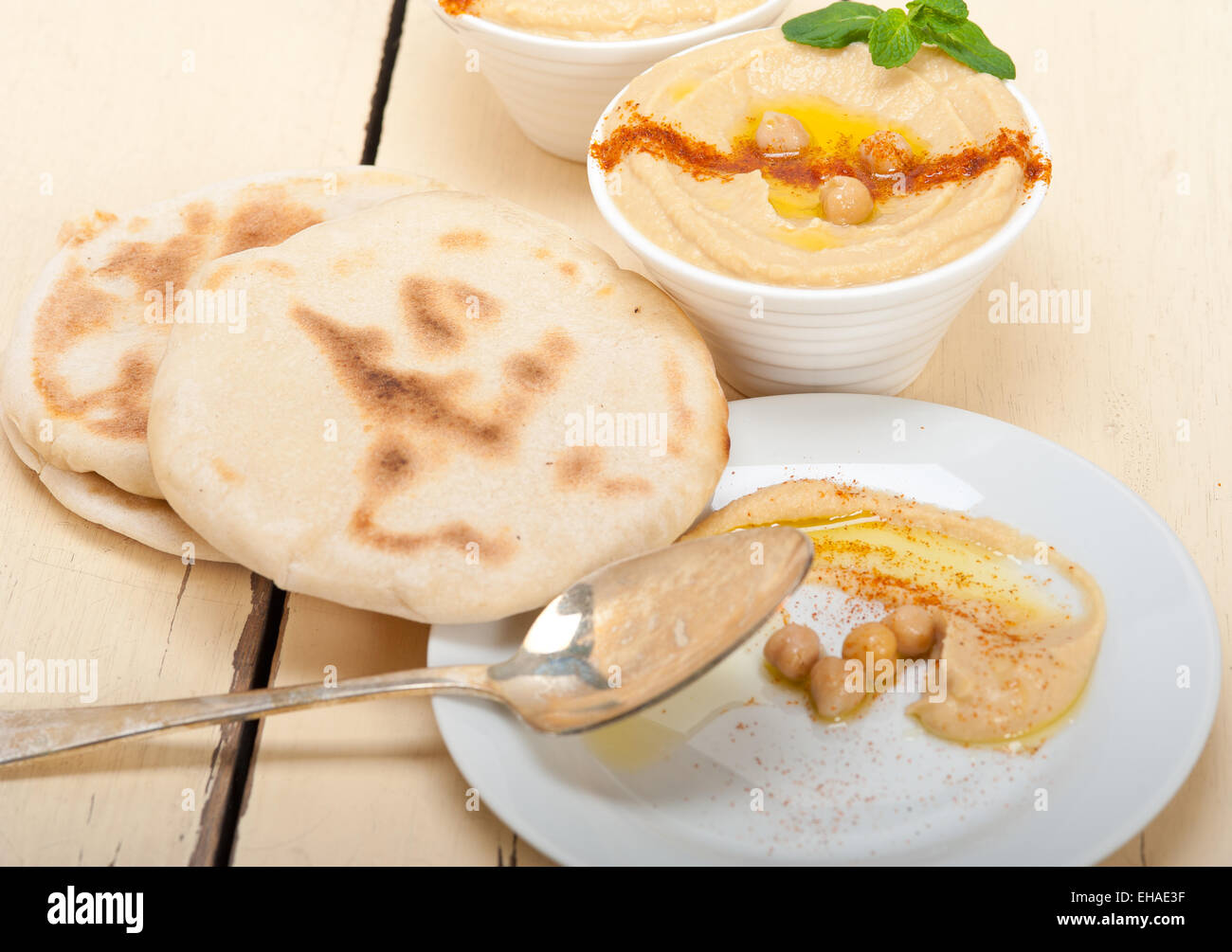 traditional chickpeas Hummus with pita bread and paprika on top Stock