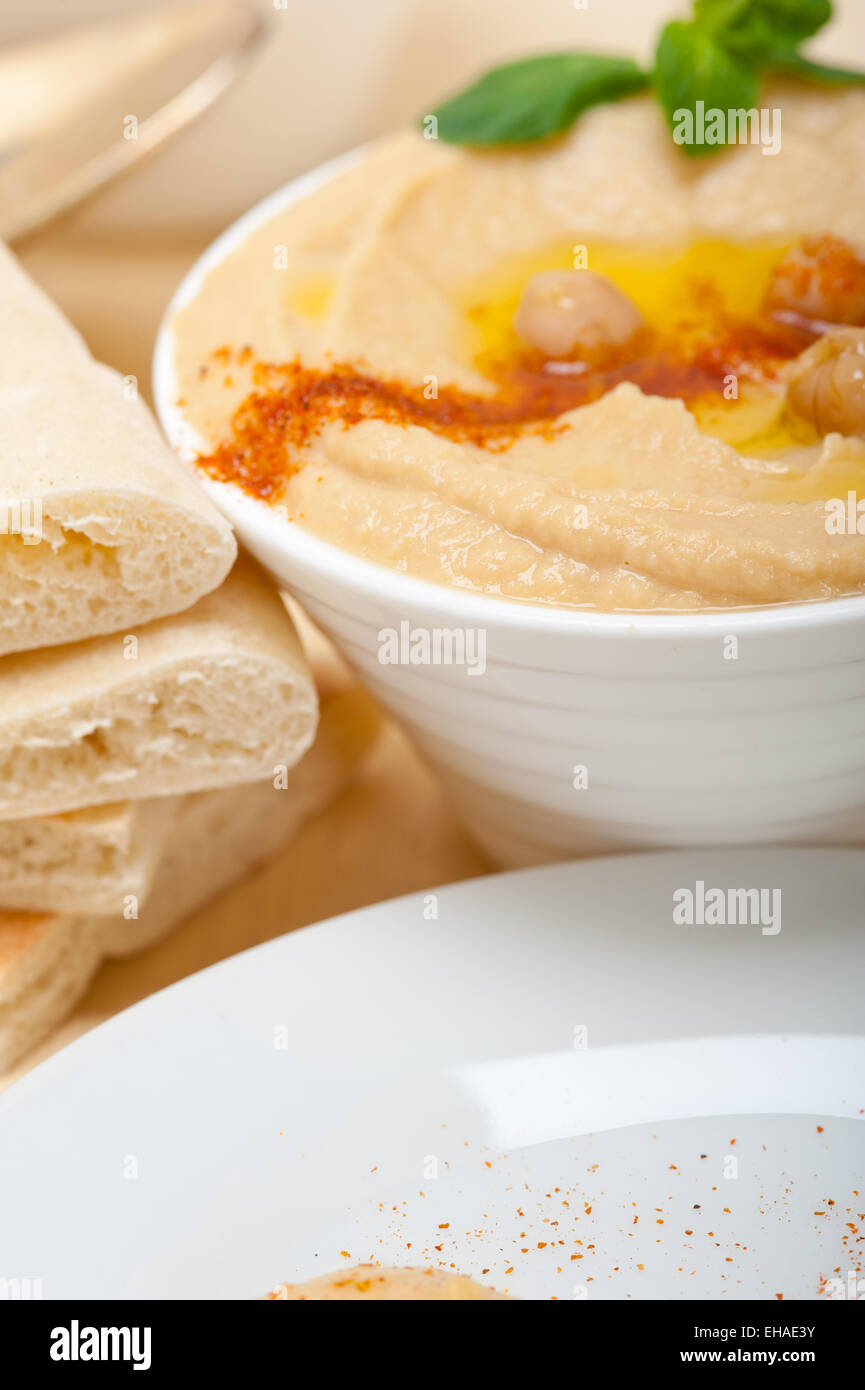traditional chickpeas Hummus with pita bread and paprika on top Stock