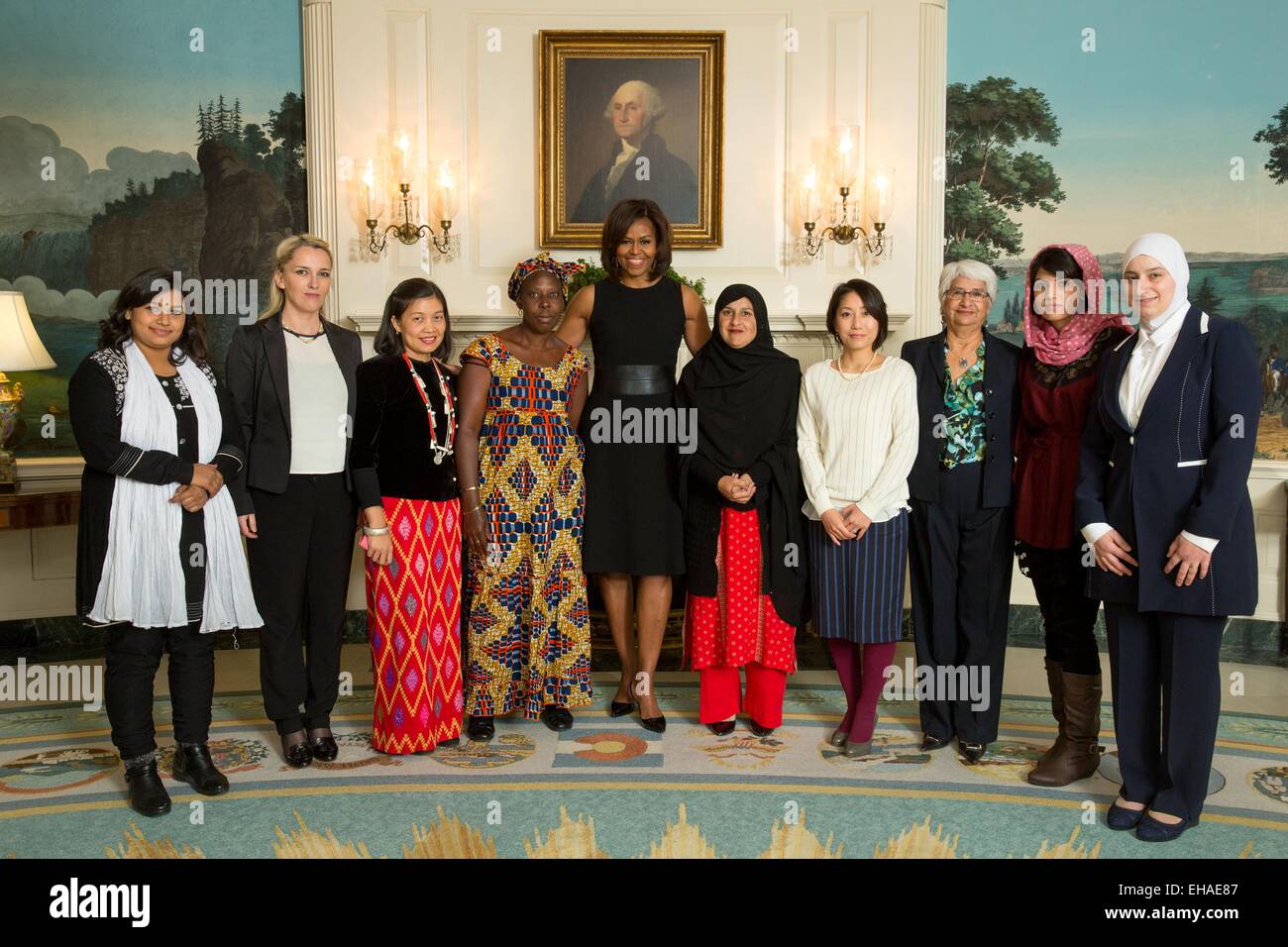 US First Lady Michelle Obama greets recipients of the State Department 2015 International Women of Courage Award recipients in the Diplomatic Reception Room of the White House March 7, 2015 in Washington, DC.  Recipients are Left to Right: Nadia Sharmeen, Bangladesh; Arbana Xharra, Kosovo; May Sabe Phyu, Burma; Marie Claire Tchecola, Guinea; Tabassum Adnan, Pakistan; Sayaka Osakabe, Japan; Rosa Julieta Montano Salvatierra, Bolivia; Captain Niloofar Rahmani; Afghanistan; Majd Chourbaji, Syria. Stock Photo