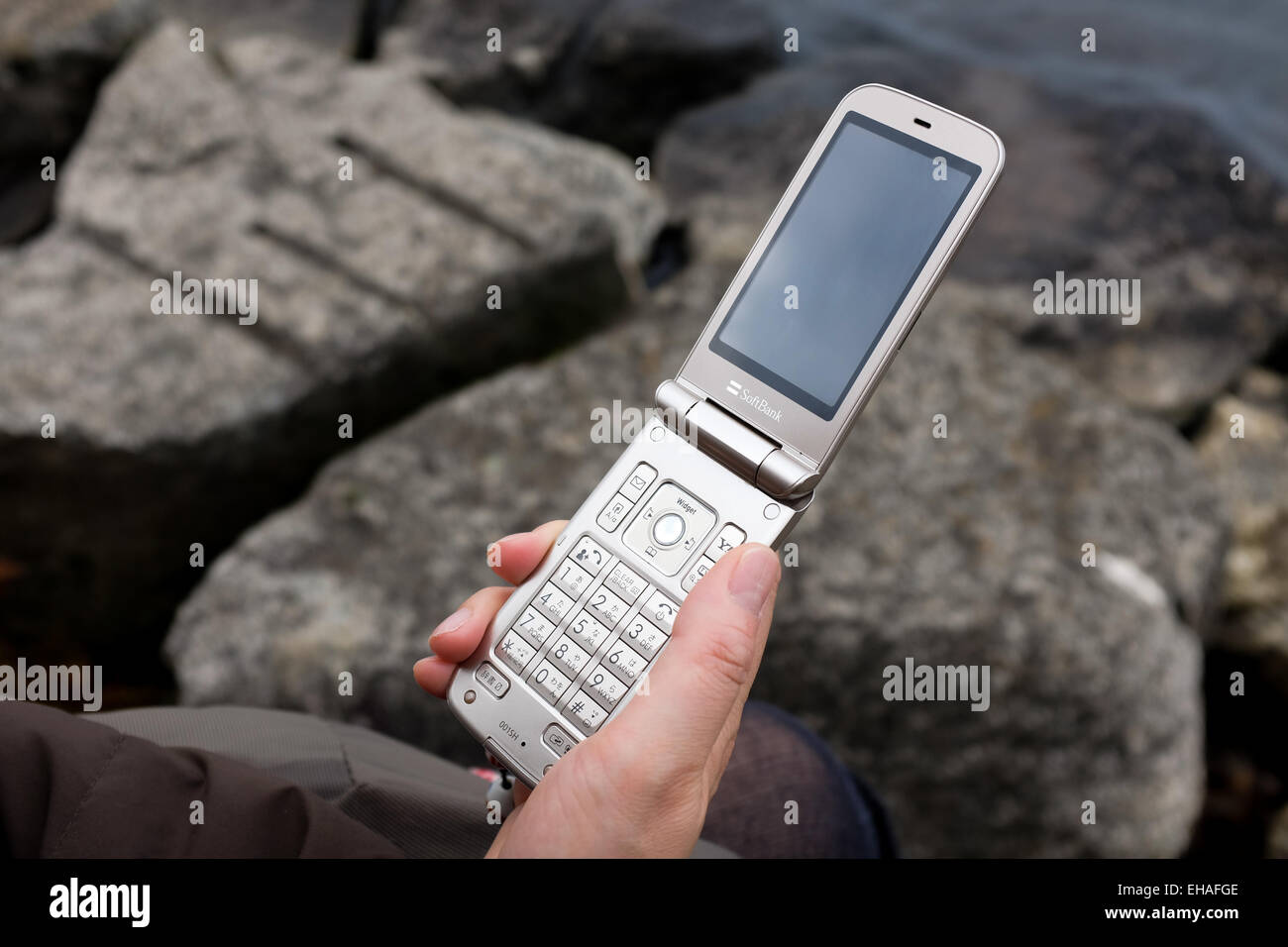 A 'flip phone', also known as a 'feature phone'. Stock Photo