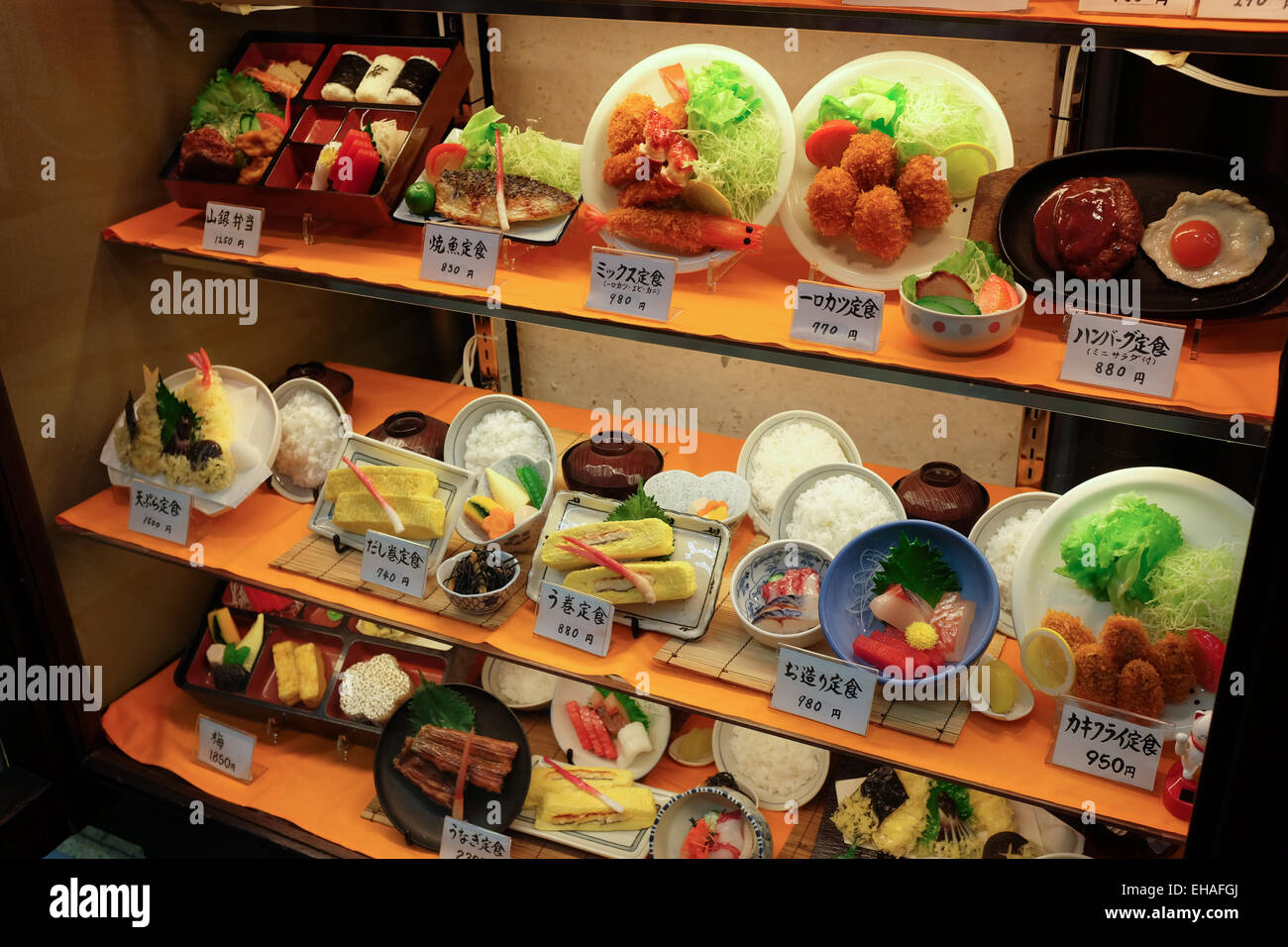 Plastic models on display in the window of a restaurant in Japan showing which dishes are available. Stock Photo