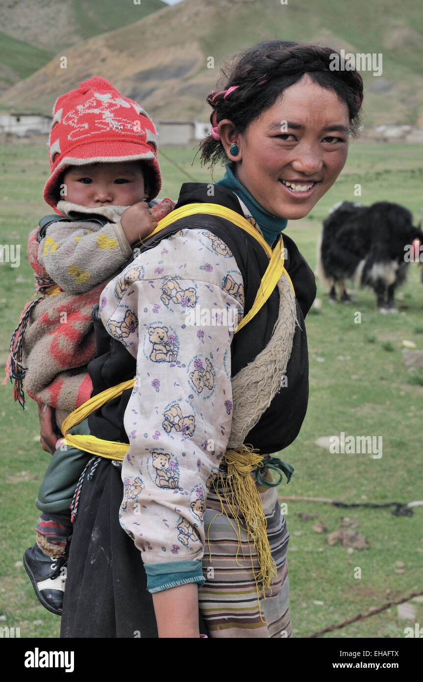 Drokpa (Nomad) Herders, Woman With Baby On Her Back Stock Photo