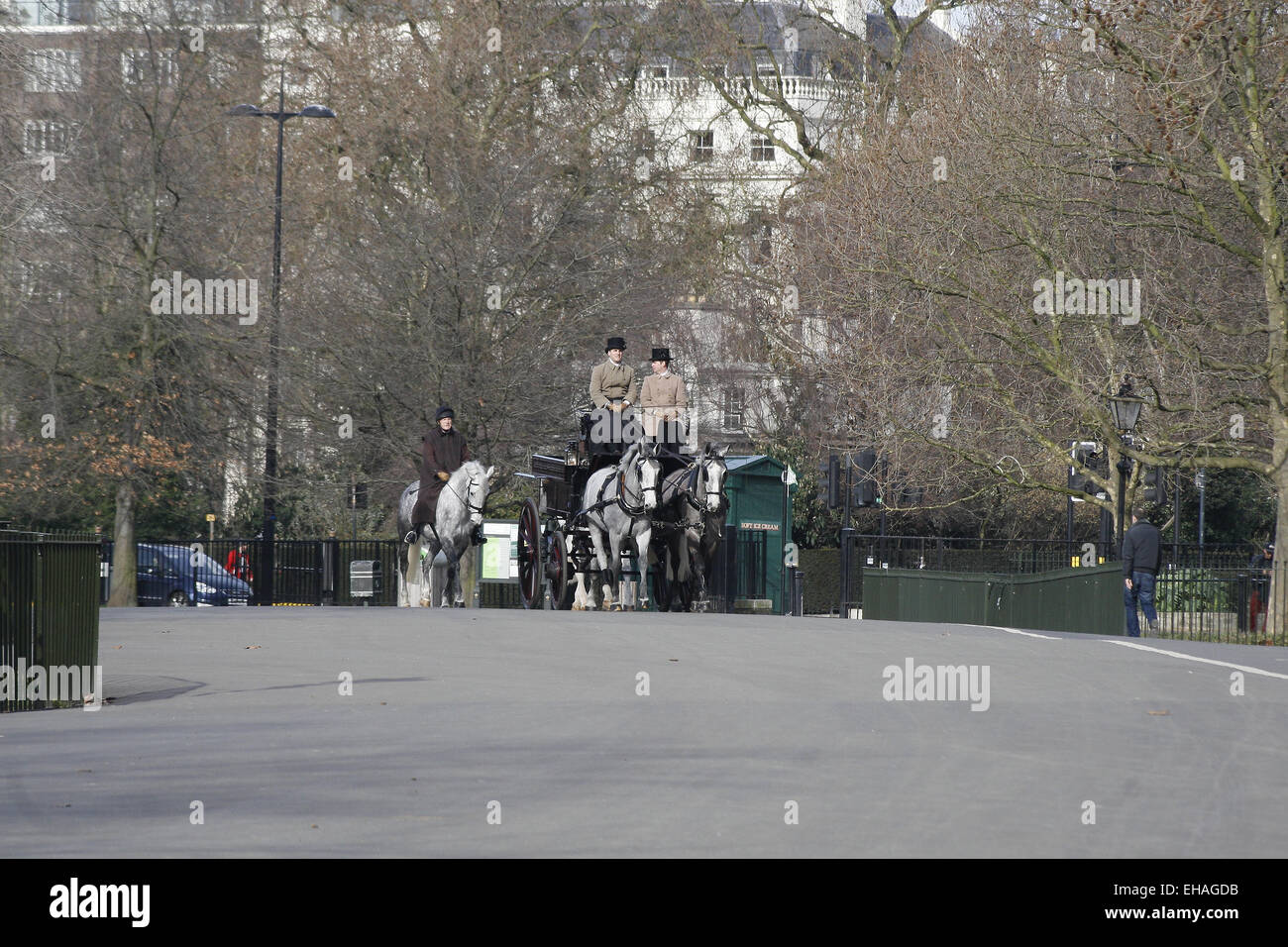 horses and cart travelling through Hyde Park, London, England,UK Stock