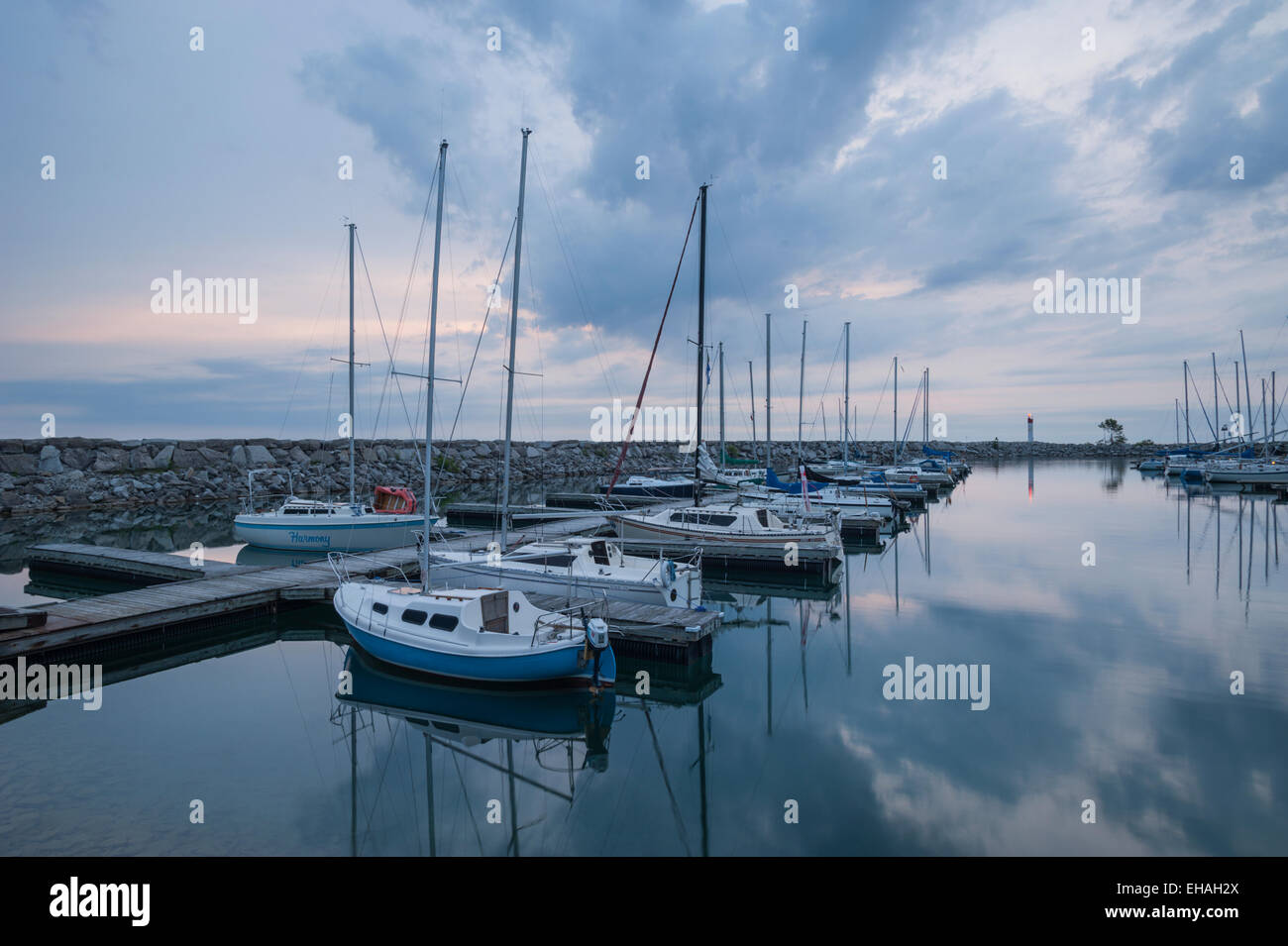 Breakwall and boat harbour at Meaford, Ontario, on a still day just before sunrise. Stock Photo