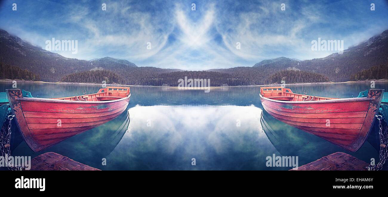 wooden boat on a mountain lake landscape mountain sky Stock Photo - Alamy
