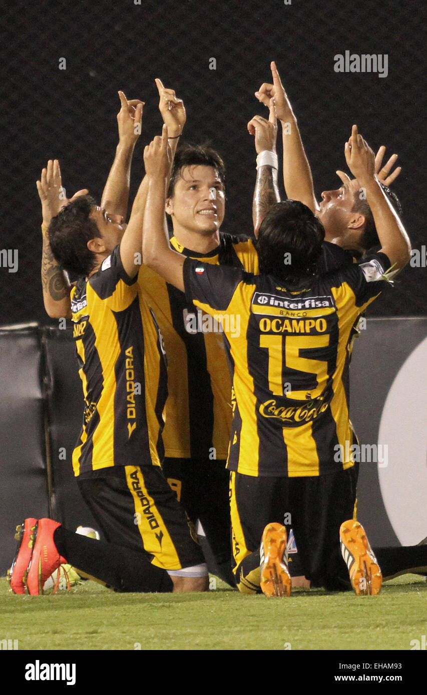 Asuncion, Paraguay. 10th Mar, 2015. Guarani's players of Paraguay celebrate a scoring during the match of Copa Libertadores against Deportivo Tachira of Venezuela in the Defensores del Chaco Stadium in Asuncion, capital of Paraguay, March 10, 2015. © Marcelo Espinosa/Xinhua/Alamy Live News Stock Photo