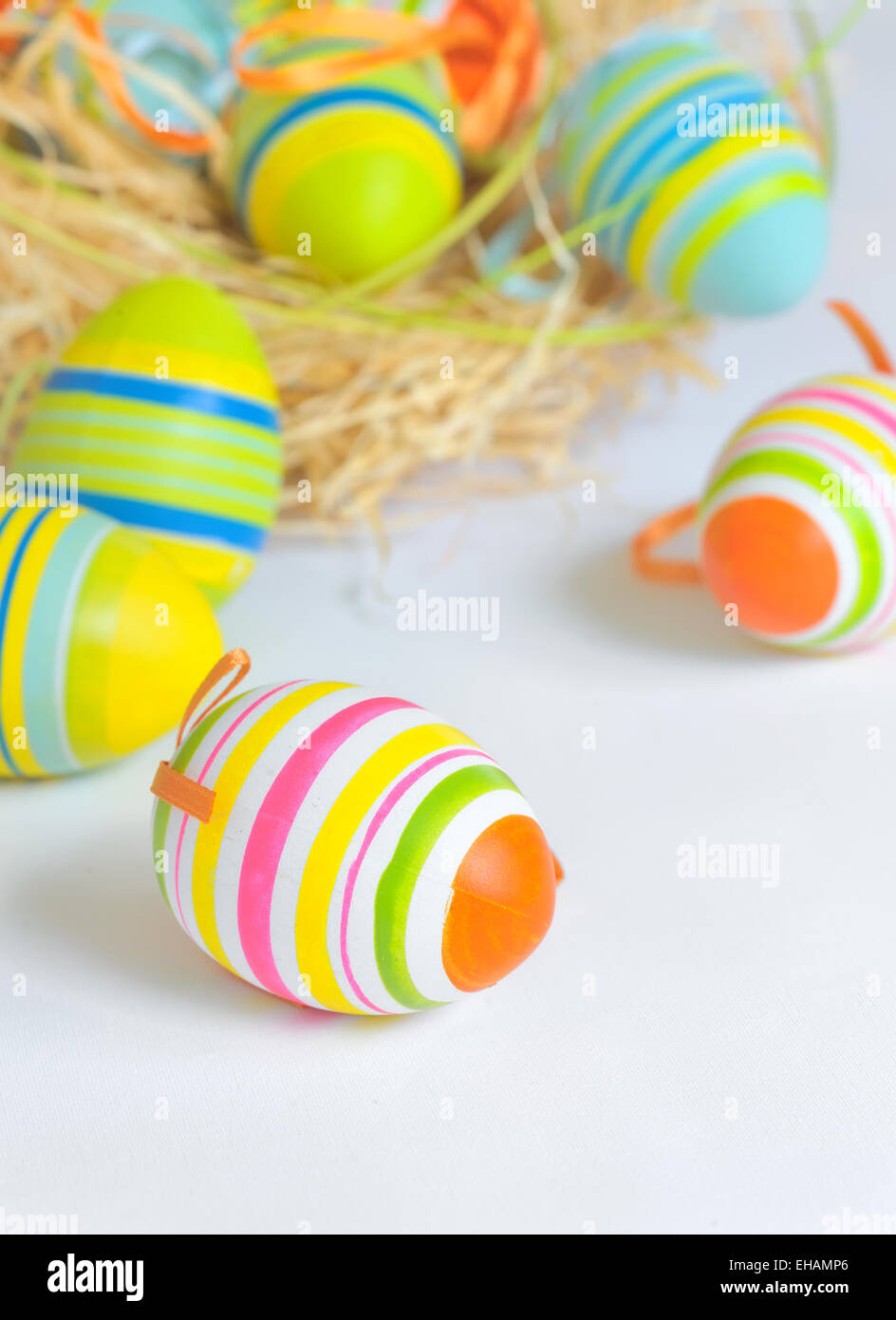 Easter eggs in nest and white background Stock Photo - Alamy